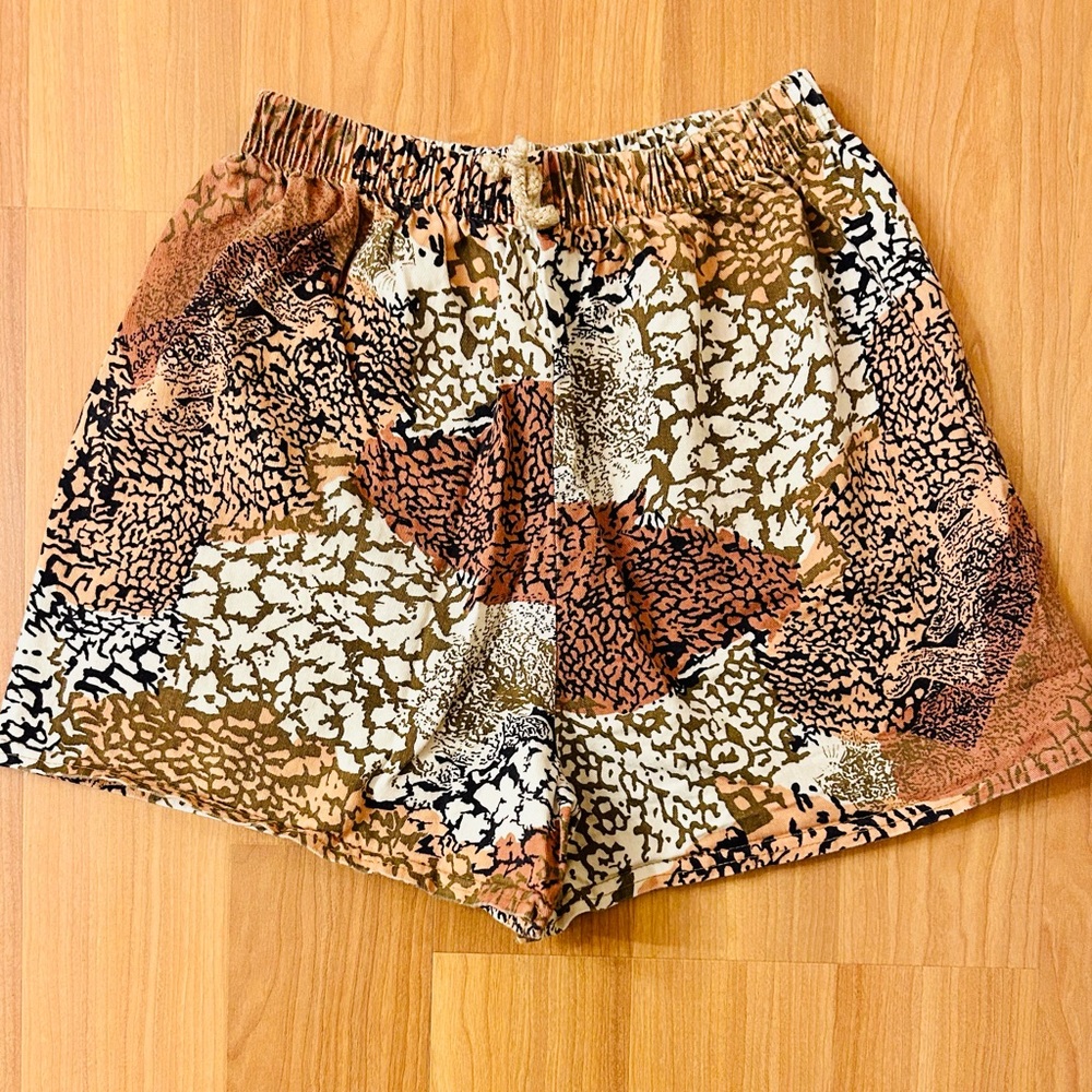 Vintage 80s wide leg animal print shorts with high rise and elastic waist